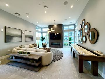 Nashville apartment for rent - A modern living room with a large sectional sofa and a coffee table.
