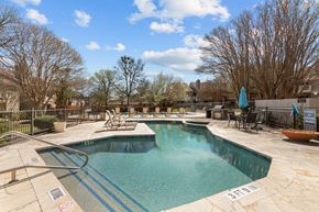 Austin apartment for rent - A swimming pool with a blue water slide.