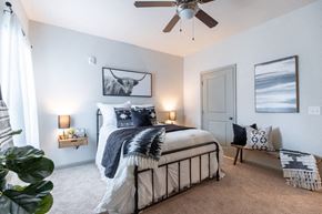 Columbia apartment for rent - a bedroom with a bed and a ceiling fan