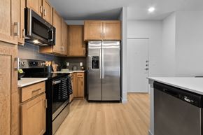 El Paso apartment for rent - A kitchen with wooden cabinets and stainless steel appliances.