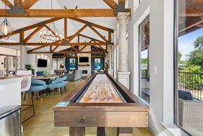Georgetown apartment for rent - A pool table is in the middle of a room with a wooden ceiling.