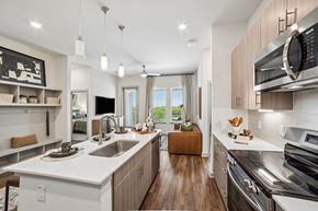 Anna apartment for rent - A modern kitchen with a white countertop and stainless steel appliances.