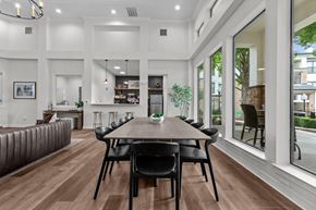 Temple apartment for rent - A modern dining room with a wooden table and chairs.