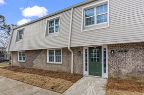 Jonesboro apartment for rent - the front of a brick house with a green door