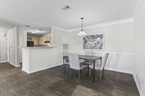 Lilburn apartment for rent - a dining room and kitchen with a table and chairs