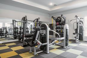 Killeen apartment for rent - a spacious fitness room with weights and cardio equipment