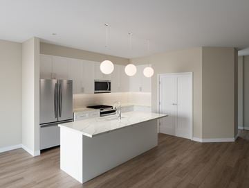 Naperville apartment for rent - A modern kitchen with a white island and stainless steel appliances.