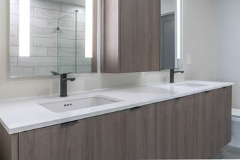 Spa-inspired bathrooms w/ backlit mirrors