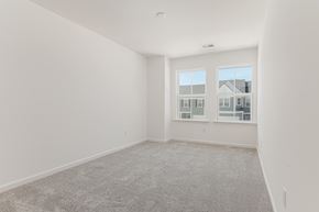 Goose Creek townhouse for rent - an empty living room with a large window and carpet