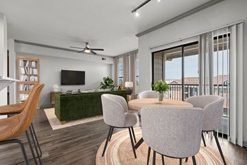 Lenexa apartment for rent - A modern living room with a green sofa and a television.