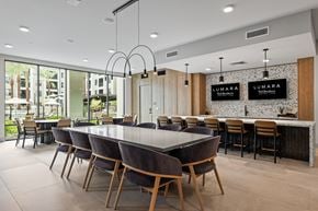 Phoenix apartment for rent - A modern dining room with a large table and chairs.