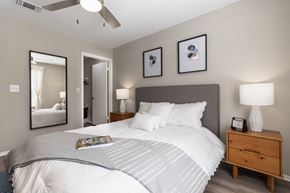 Orlando apartment for rent - A bedroom with a large bed and a ceiling fan.
