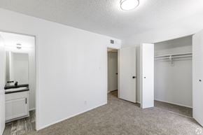 Albuquerque apartment for rent - A white bedroom with a sink and a closet.