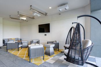 Heated and cooled outdoor social lounge with 70” glare-free tv’s