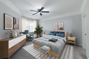 Kingwood apartment for rent - a bedroom with a large bed and a ceiling fan