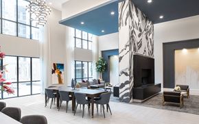 Houston apartment for rent - a dining room with a table and chairs and a fireplace