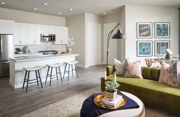 Houston apartment for rent - a living room with a kitchen and a green couch