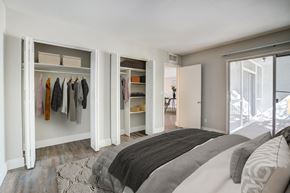 Jacksonville apartment for rent - a bedroom with a bed and a closet