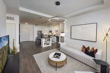 Atlanta apartment for rent - A modern living room with a white sofa and a coffee table.