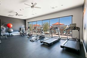 Tucson apartment for rent - A gym with treadmills, exercise balls, and other equipment.