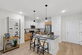 Pooler apartment for rent - A kitchen with a table and chairs in the middle of it.