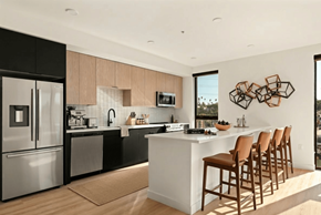 Los Angeles apartment for rent - A modern kitchen with a large island and wooden chairs.