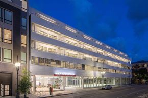 New Orleans apartment for rent - A modern building with a bicycle parked in front.