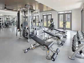 Cibolo apartment for rent - A spacious gym with a variety of equipment including treadmills, weights, and exercise machines.