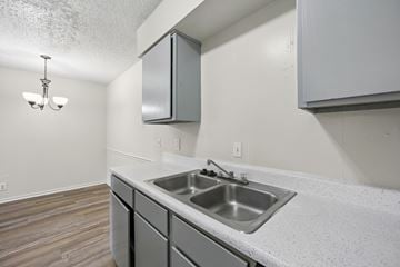 Stephenville apartment for rent - A kitchen with a sink and a cabinet.