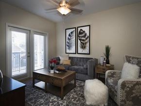 Oklahoma City apartment for rent - a living room with a couch and a coffee table