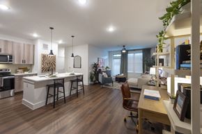 Katy apartment for rent - A modern kitchen with a dining table and chairs.