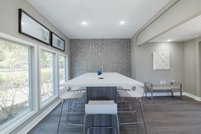 Richmond apartment for rent - A dining room with a white table and chairs.