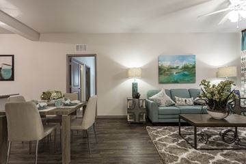 Naples apartment for rent - A living room with a dining table and chairs.