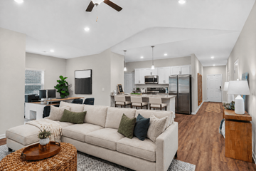 Pooler apartment for rent - A modern living room with a white couch and a wooden coffee table.