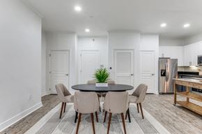 Baton Rouge apartment for rent - a living room with white walls and a table with chairs
