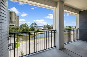 Panama City Beach apartment for rent - a balcony with a view of a city and a river
