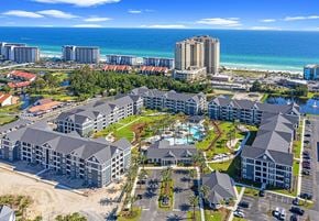 Panama City Beach apartment for rent - an aerial view of the resort with the ocean in the background