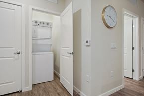 Aurora apartment for rent - A kitchen with a white oven and a clock on the wall.
