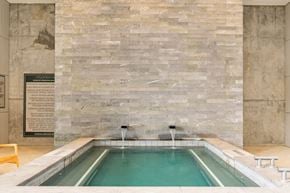 San Antonio apartment for rent - A pool with a waterfall in the middle of it.