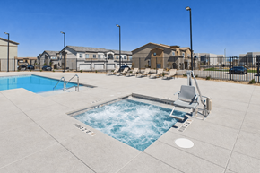 Las Vegas townhouse for rent - A small pool with a slide in the middle of a concrete patio.