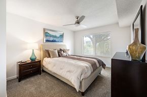 Fort Myers apartment for rent - a bedroom with a bed and a ceiling fan