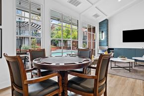 Austin apartment for rent - a dining room with a table and chairs and a large window
