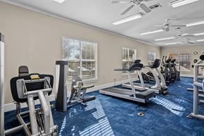 Killeen apartment for rent - a gym with treadmills and other exercise equipment and windows