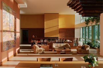 Phoenix apartment for rent - A living room with a large painting on the wall and a coffee table in the center.