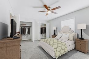 Forest Park apartment for rent - a bedroom with a bed and a ceiling fan