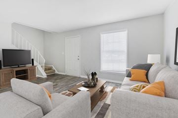Forest Park apartment for rent - A living room with a grey couch and a coffee table.