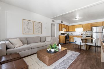 Yuma apartment for rent - A living room with a grey couch and a coffee table in the middle.