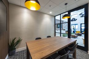 Houston apartment for rent - a conference room with a wooden table and chairs