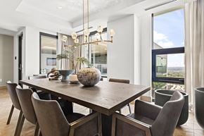 Atlanta apartment for rent - A modern dining room with a large table and chairs.