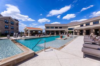 Resort-style swimming pool with cabana and grills